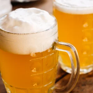 Two cold beers with thick foam